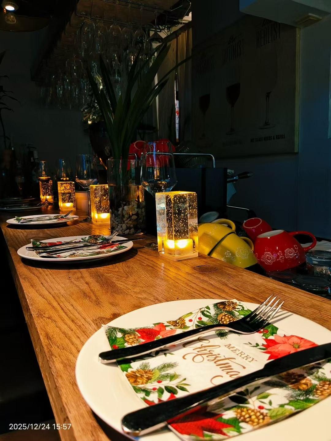 Candlelit place settings at Justgrapes