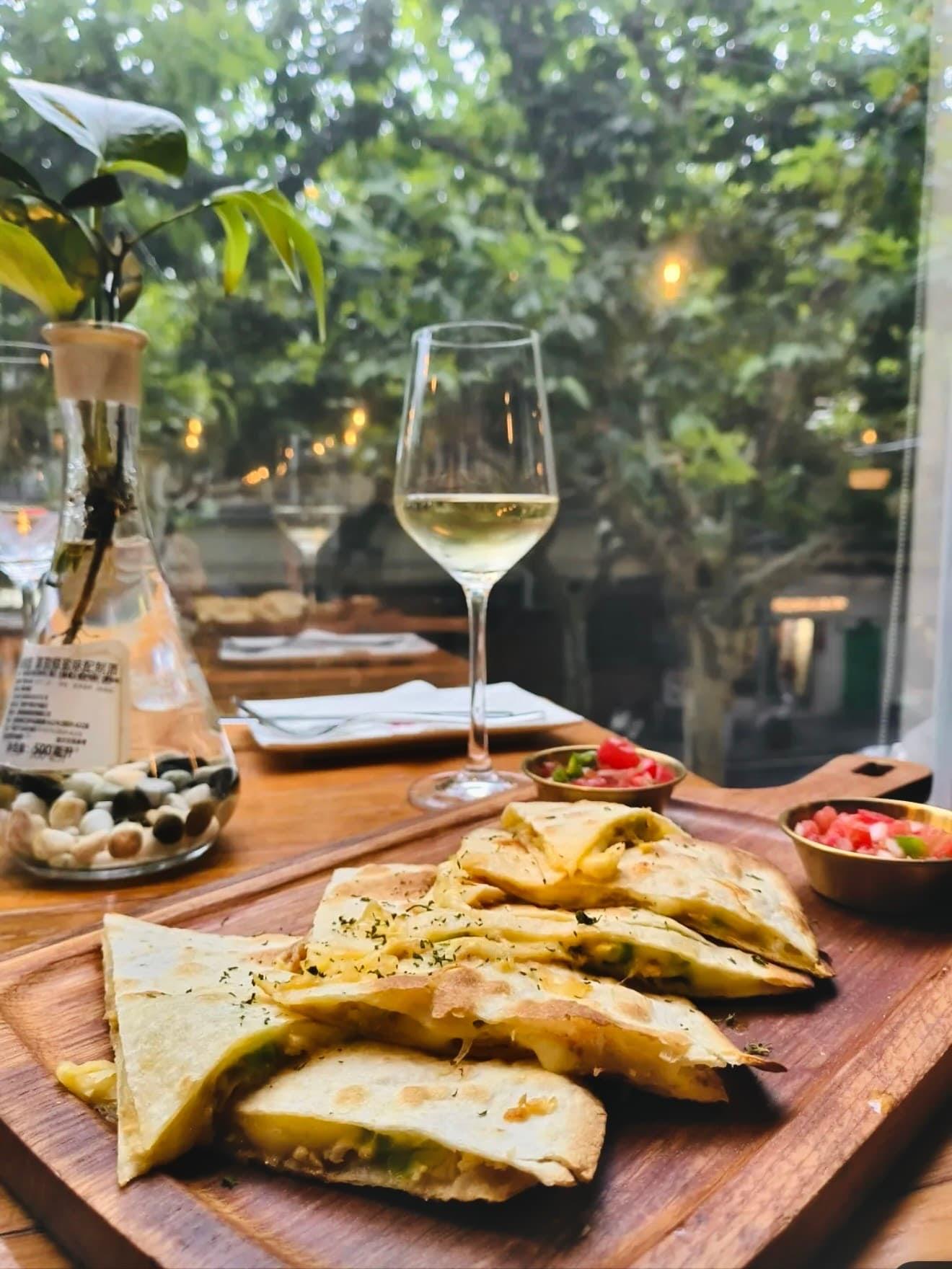 Pale white wine poured outdoors at Justgrapes